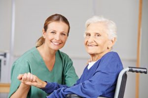 37735392 - geriatric care with nurse and happy senior woman in a wheelchair